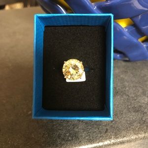Yellow stone ring.  Rhodium over .925 sterling silver. Size 8